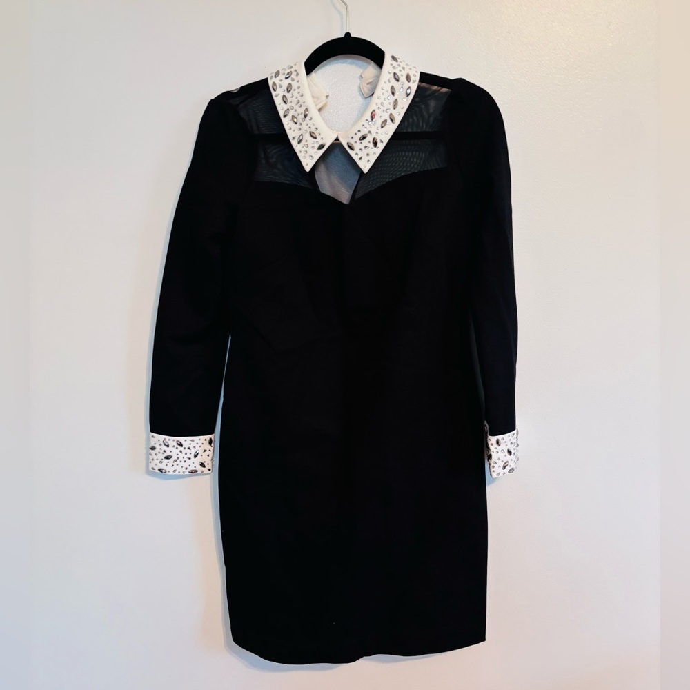Boston Proper Wednesday Adam’s goth black dress with white collar, has jewels